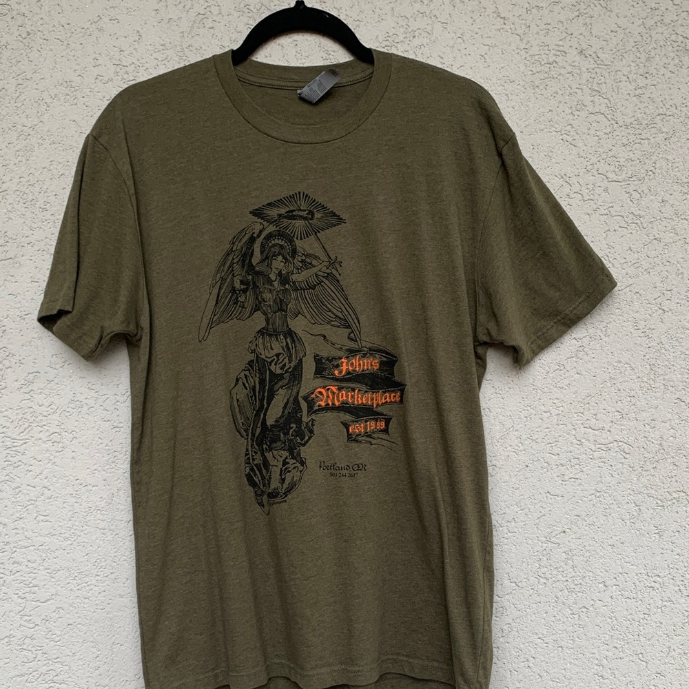 John’s Marketplace T shirt  olive green with angel graphic
